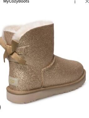 UGG Mini Bailey Bow Sparkle Ankle Boots in Gold